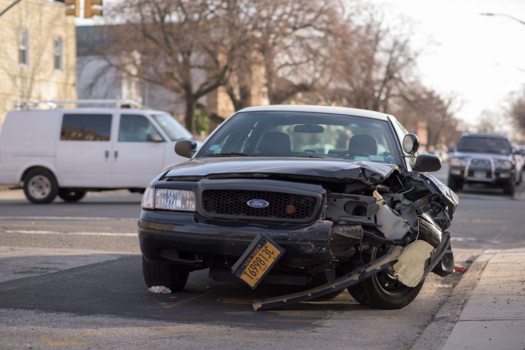 A crashed car requires accident recovery services.